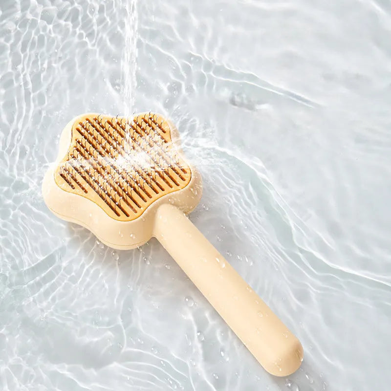 Self-cleaning cat comb magic wand with stainless steel needle teeth in green or yellow colour options
