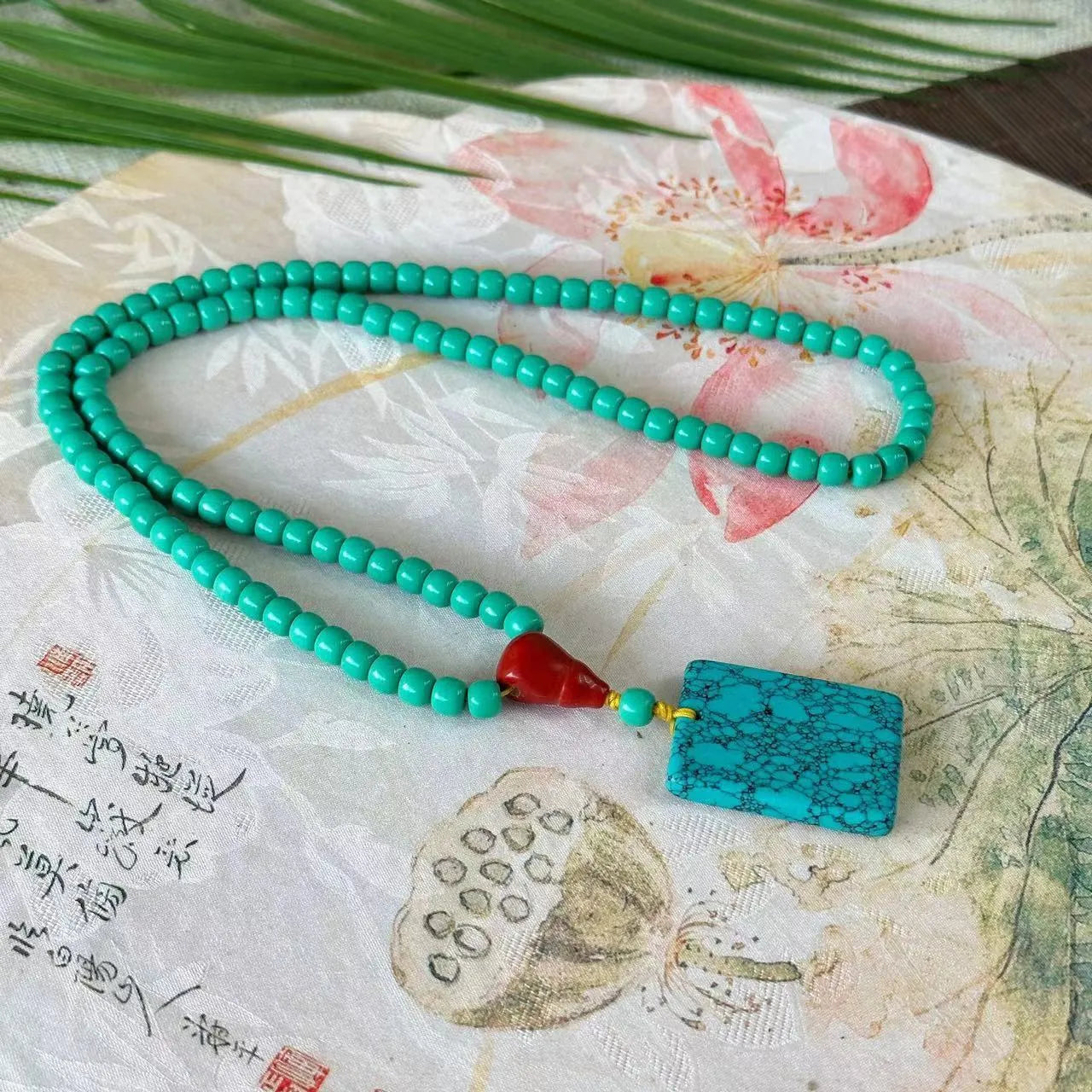 Turquoise mesh flower lucky pendant necklace with ball bead chain, adjustable length.