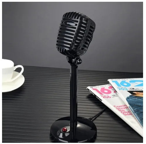 Black USB condenser microphone on an adjustable stand with a foam pop filter and weighted base.