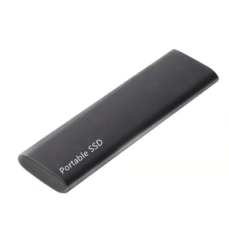 Metal-shell portable solid state drive with ultra-thin design on a desk.