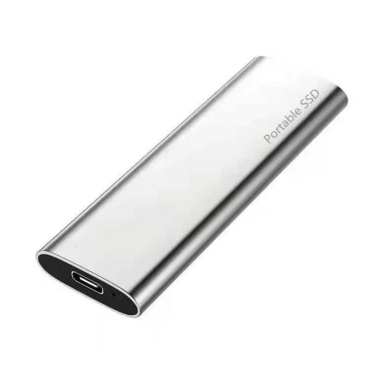 Metal-shell portable solid state drive with ultra-thin design on a desk.
