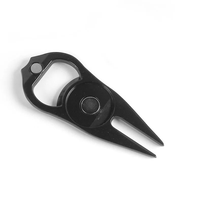 Zinc alloy golf ball yoke and bottle opener tool in black or green on a putting green.