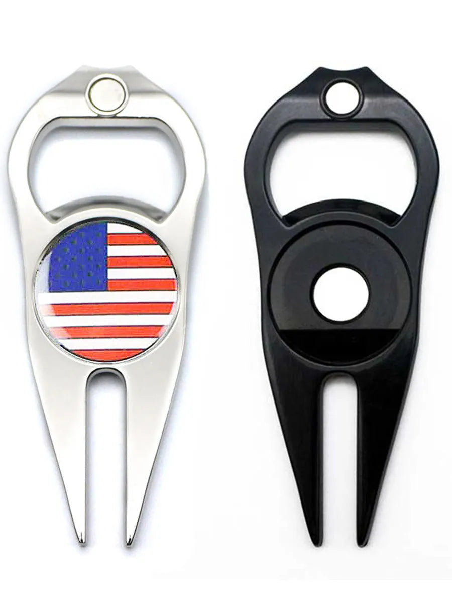 Zinc alloy golf ball yoke and bottle opener tool in black or green on a putting green.