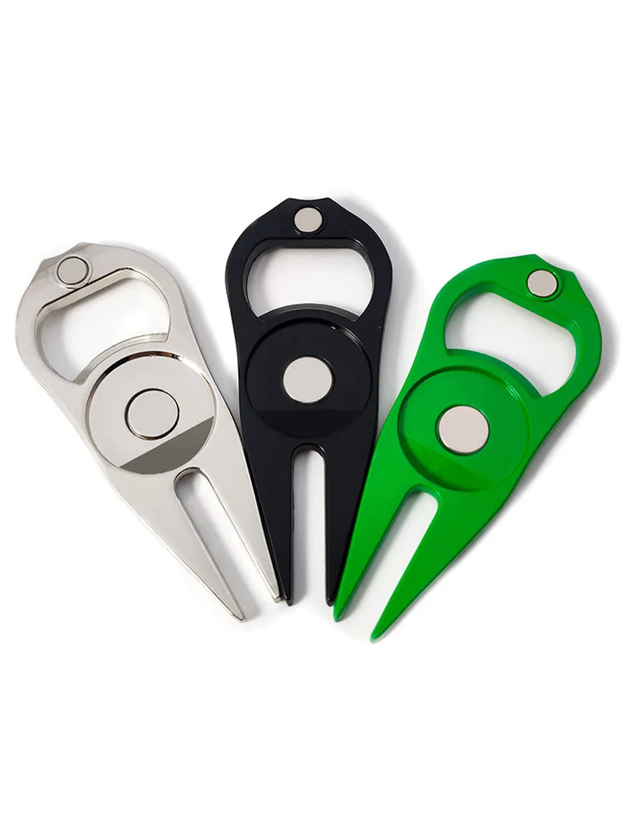 Zinc alloy golf ball yoke and bottle opener tool in black or green on a putting green.