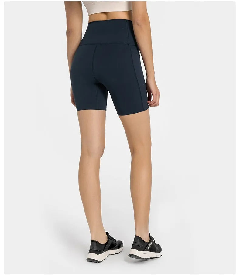 Women's black cotton blend super stretch sports shorts with mid-rise waist and short length.