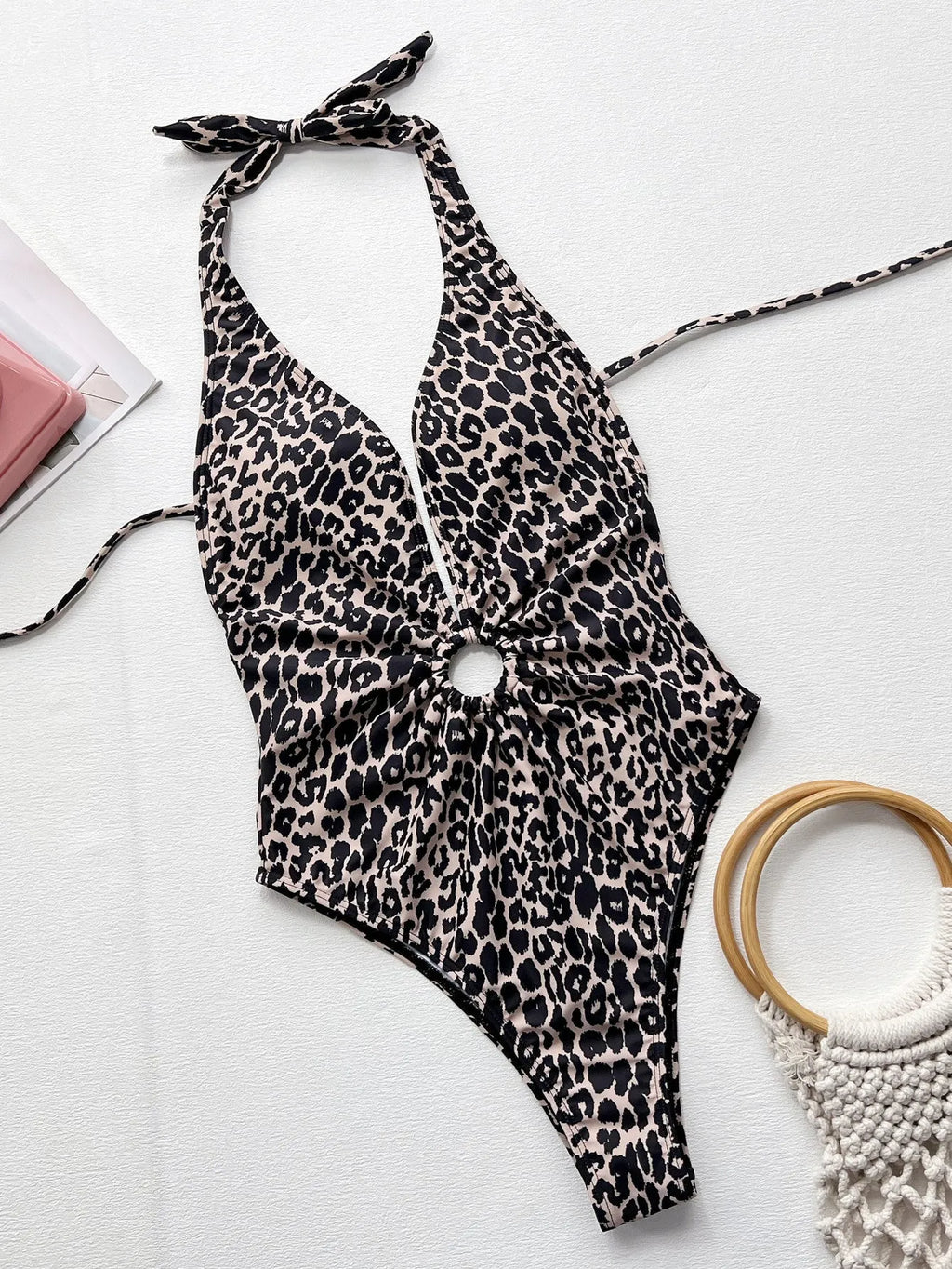 Leopard print hollow-out one-piece swimsuit in bikini style for women.