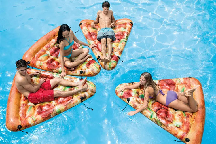 Large green and red pizza slice inflatable surfboard floating on water
