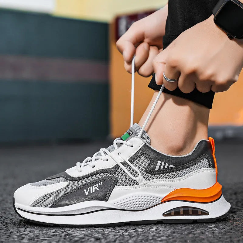 Men's grey breathable mesh casual running shoes with a round toe and EVA sole on a white background.