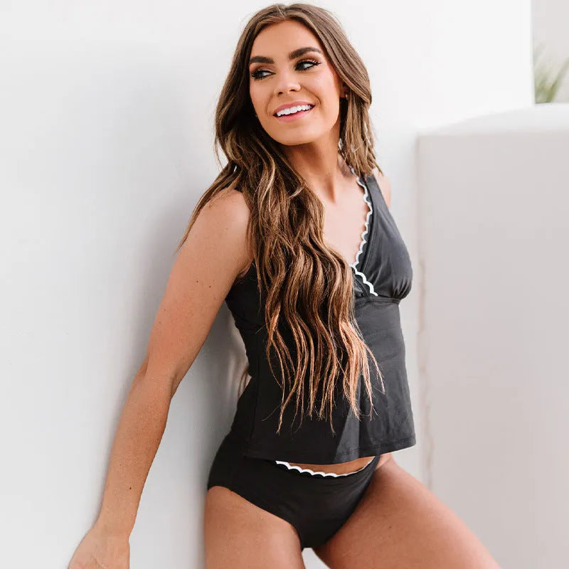 Black women's one-piece swimsuit with split front design and sleeveless cut