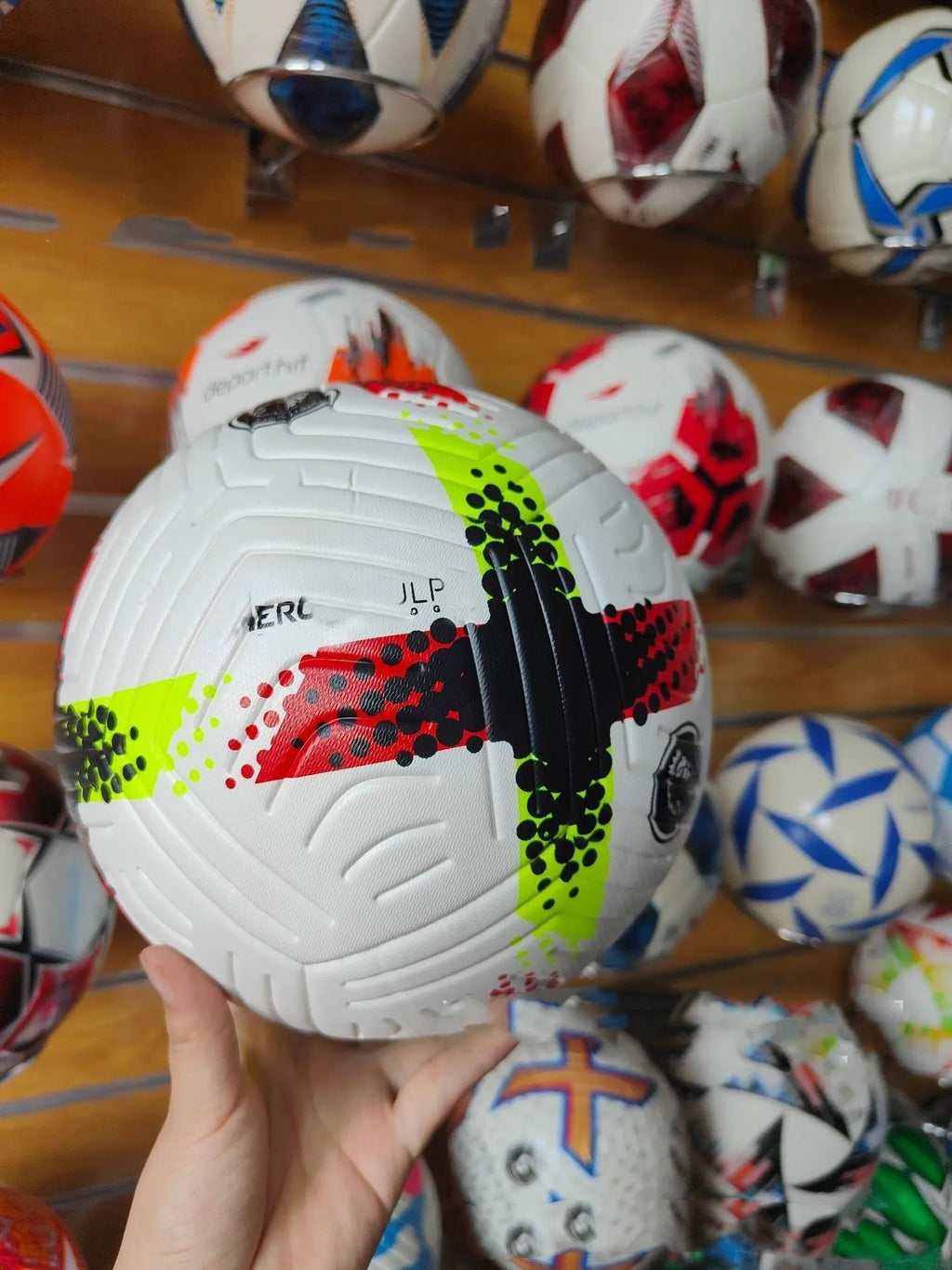 Fluorescent green Size 5 football on grass pitch for club training and matches