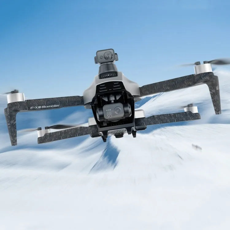White folding quadcopter drone with camera, remote control, flight batteries, and shoulder bag.