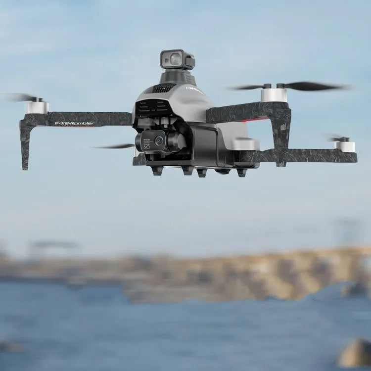 White folding quadcopter drone with camera, remote control, flight batteries, and shoulder bag.