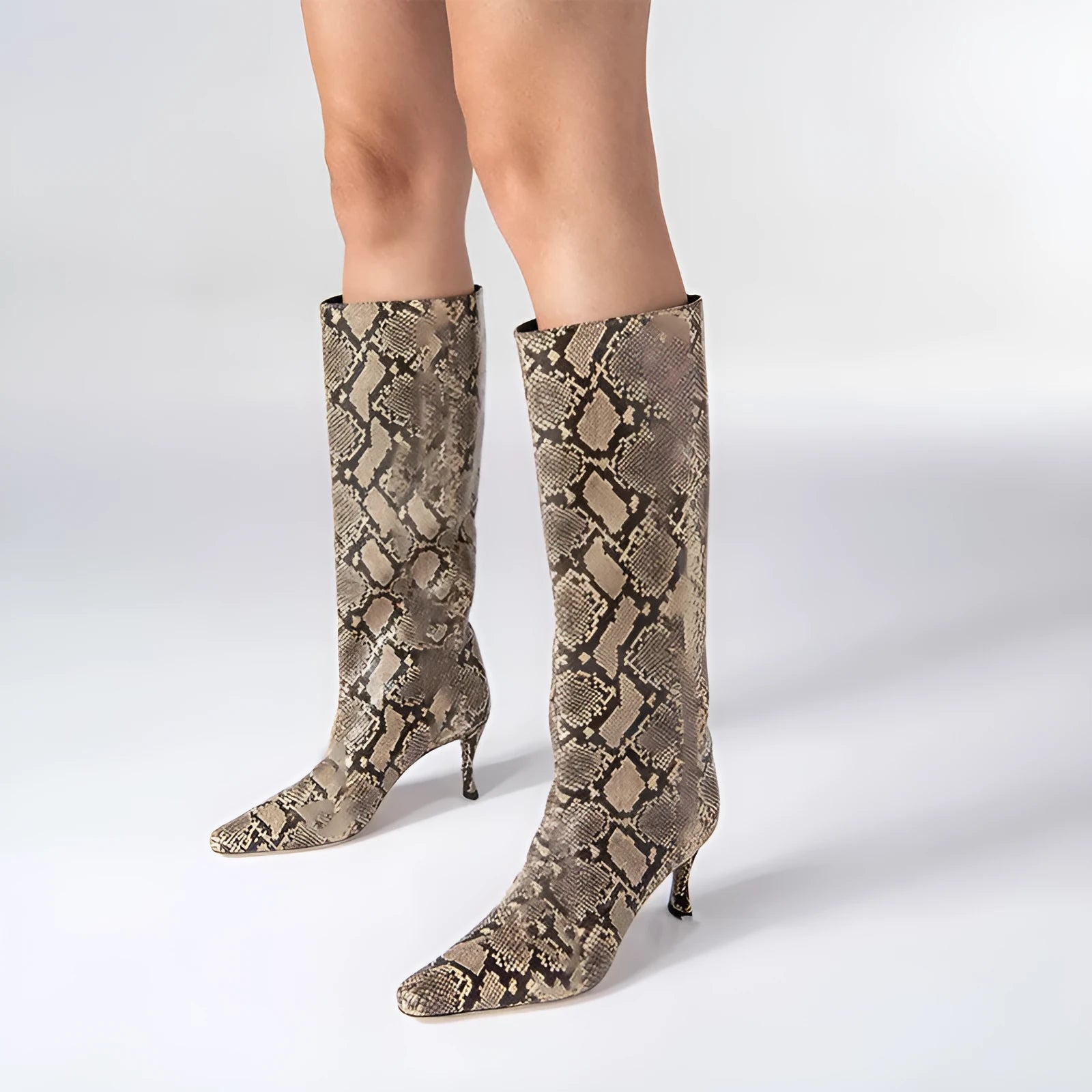 Women's square toe cowboy boot in a selection of colours including black, snake pattern, and brown stone.