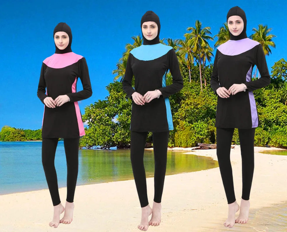 Conservative black women's swimsuit with hood, long sleeves, and full-length pants in a two-piece set.