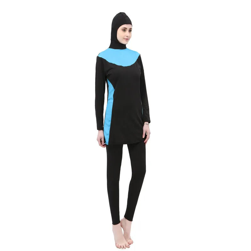 Conservative black women's swimsuit with hood, long sleeves, and full-length pants in a two-piece set.