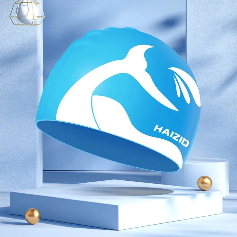 Silicone swim cap with waterproof ear protectors featuring whale tail design in multiple colours