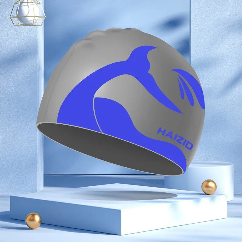 Silicone swim cap with waterproof ear protectors featuring whale tail design in multiple colours