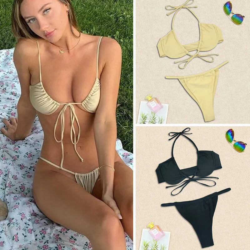 Women's black and mint green nylon split bikini swimsuit set on a mannequin