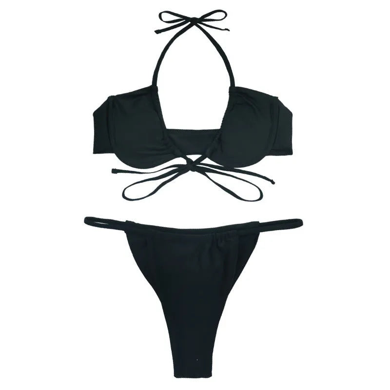 Women's black and mint green nylon split bikini swimsuit set on a mannequin