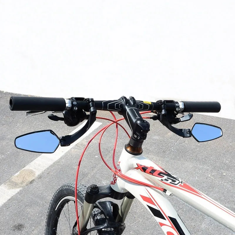 Black rotatable acrylic rearview mirror for mountain bike handlebars.