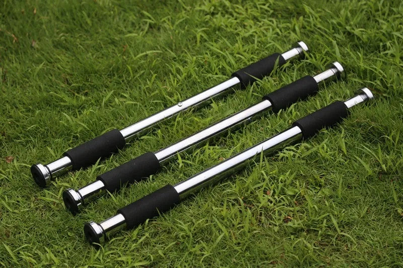 Adjustable steel pull-up bar extended for doorway installation with length markings showing 62cm to 100cm range