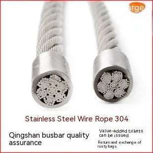 Close-up of a coiled 304 stainless steel multi-strand security cable on a grey background.