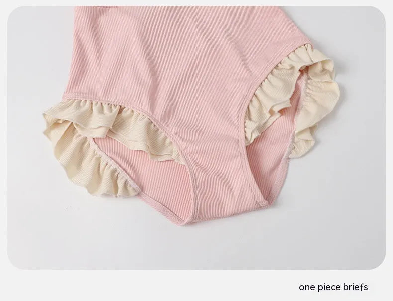 Pink conservative one-piece swimsuit with Siamese-themed detailing for women in nylon fabric