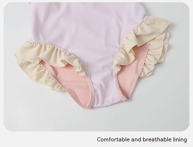 Pink conservative one-piece swimsuit with Siamese-themed detailing for women in nylon fabric