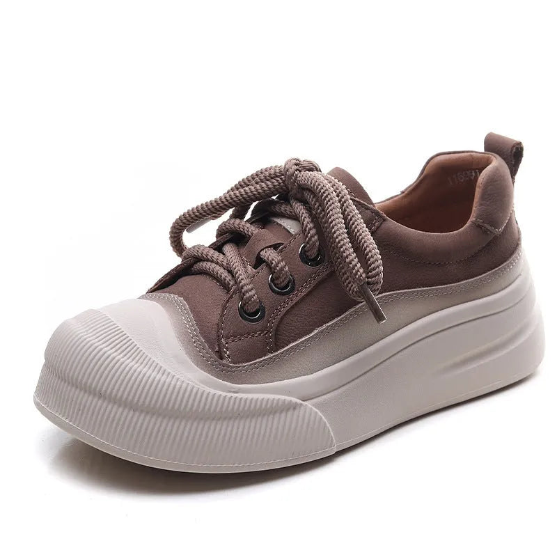 Women's yellow lace-up casual leather shoes with round toe and rubber sole on a neutral background.