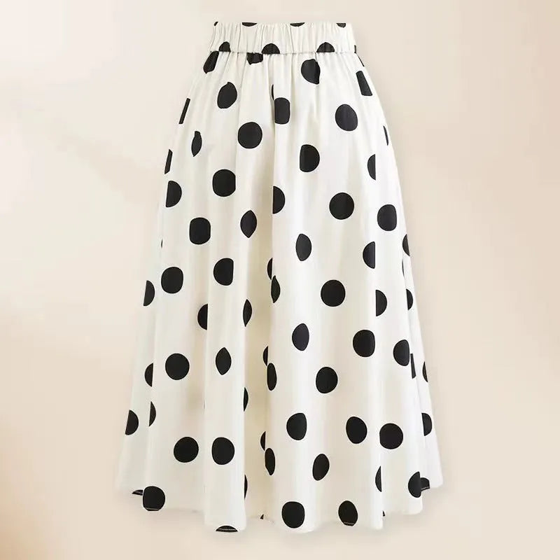 Women's black one-piece swimsuit with white round skirt and bow detail for beach and swimming