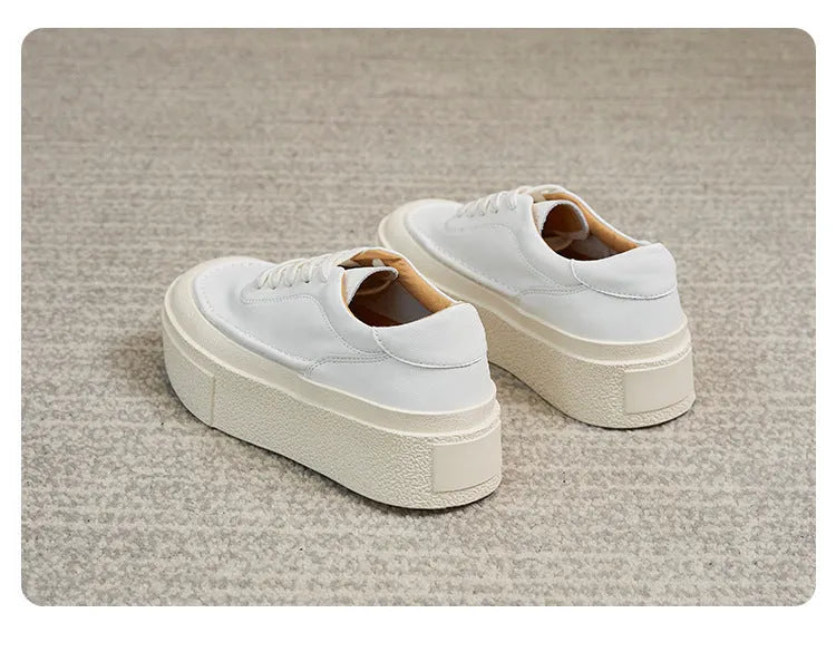 Women's black and white platform casual shoes with embossed cowhide leather and round toe design
