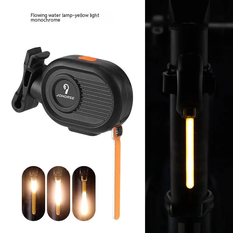 Bicycle taillight with colourful running water LED light effect mounted on a bike seat post.