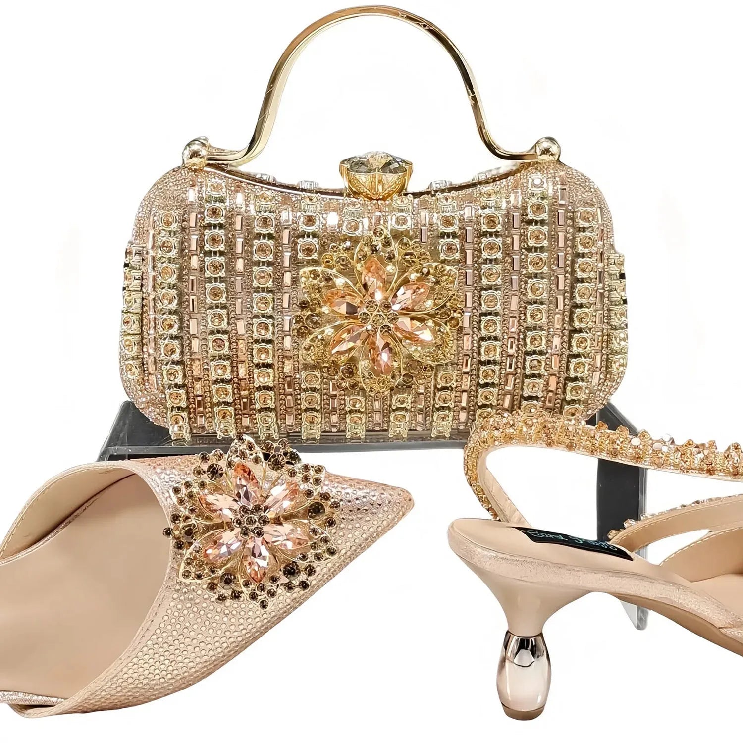 Women's black synthetic leather high-heel shoes with rhinestone ankle chain and matching hard clutch bag.
