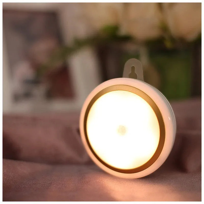 Smart body motion sensor LED night light with 80mm diameter showing warm and white light options