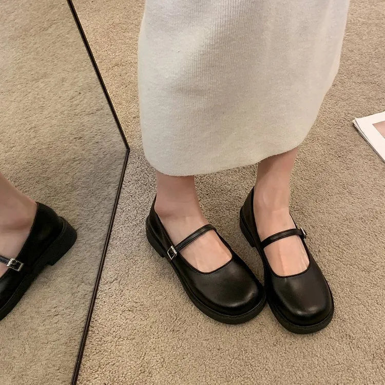 Women's solid colour French vintage flat shoes with a round toe, shown in red, black, and grey.