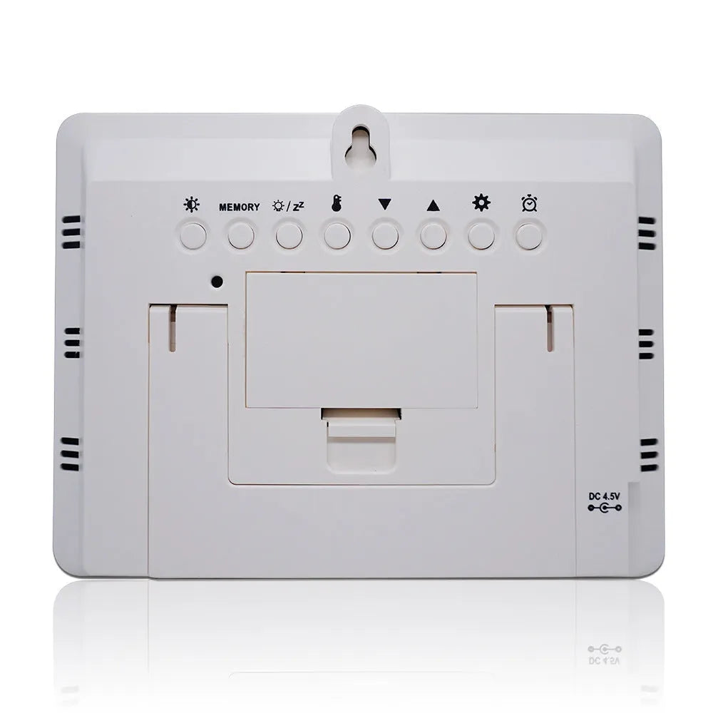 Black rectangular digital weather station with LCD display showing temperature, humidity, and weather data