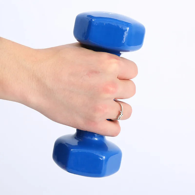Colourful plastic fitness dumbbells in bright colours with glossy surface coating