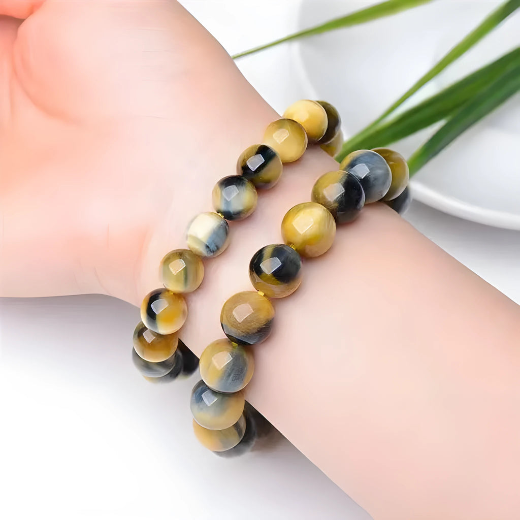Fantasy tiger eye agate bracelet with geometric round beads in a unisex single circle design.