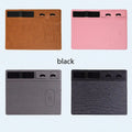 Large pink wireless charging mouse pad with integrated mobile phone holder on a desk.