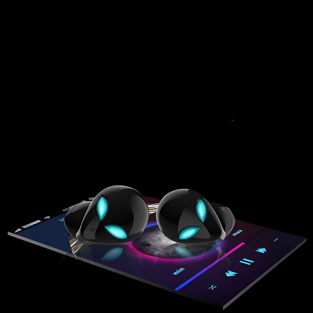 Creative Outer T8 Starman alien-design Bluetooth earbuds with red lighting next to wireless charging case.