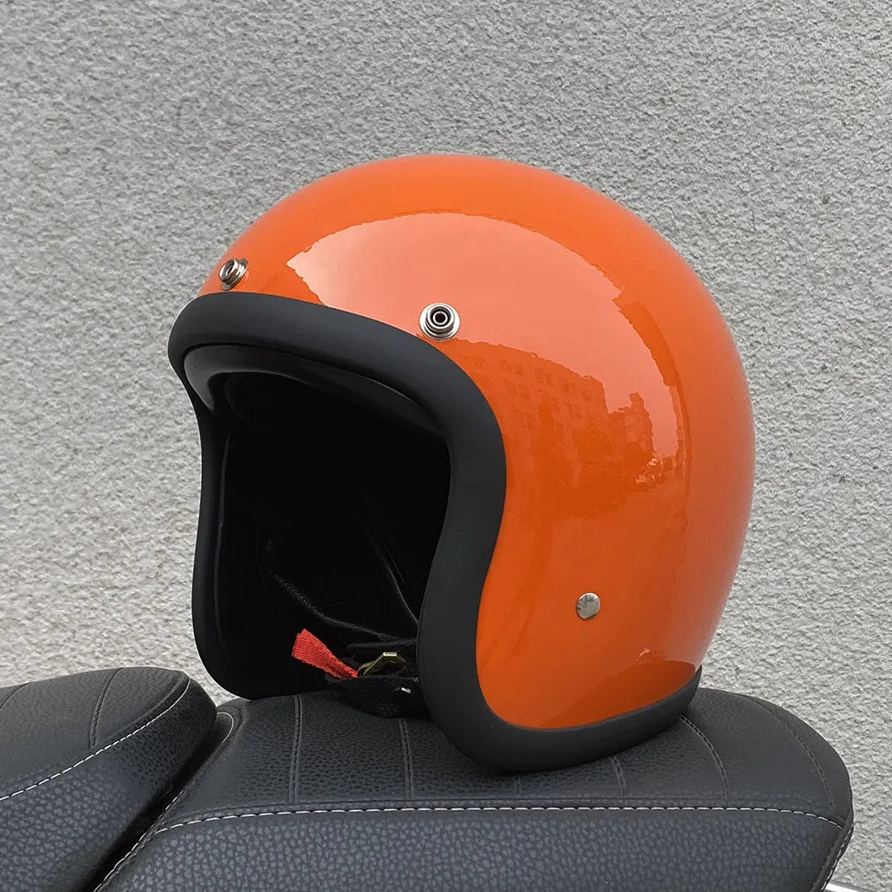 Retro-style half helmet for motorcycles with a fibreglass shell shown in a cement grey colour.