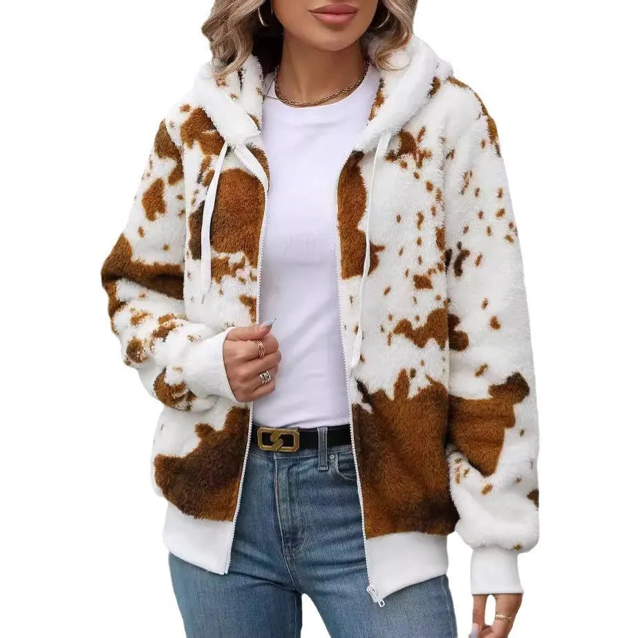 Yellow brown cow print hooded cardigan jacket with front zipper on a model.