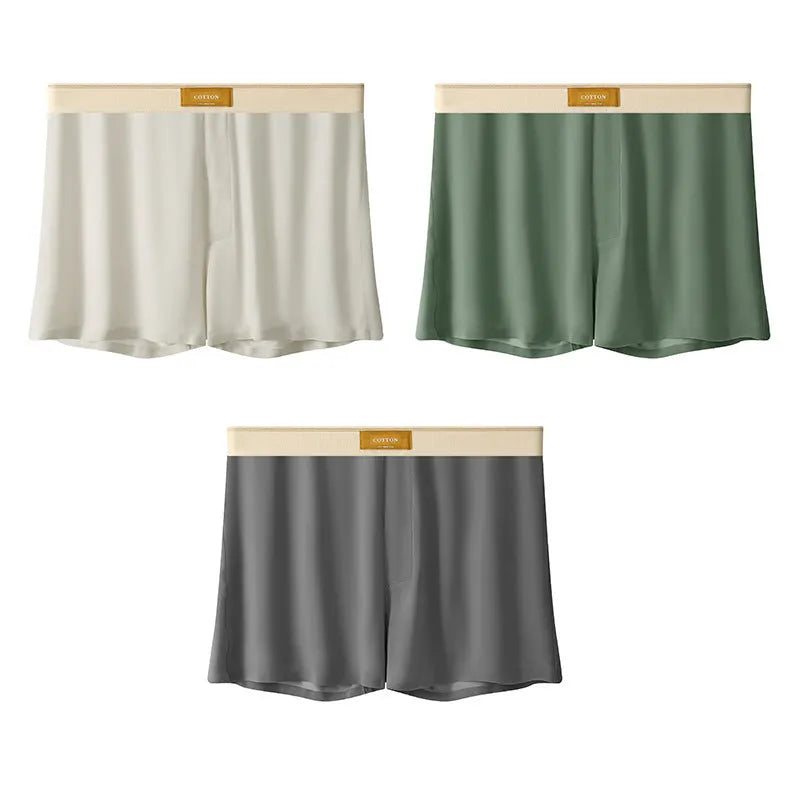 Pack of three pairs of men's solid colour ice silk underwear on a white background.
