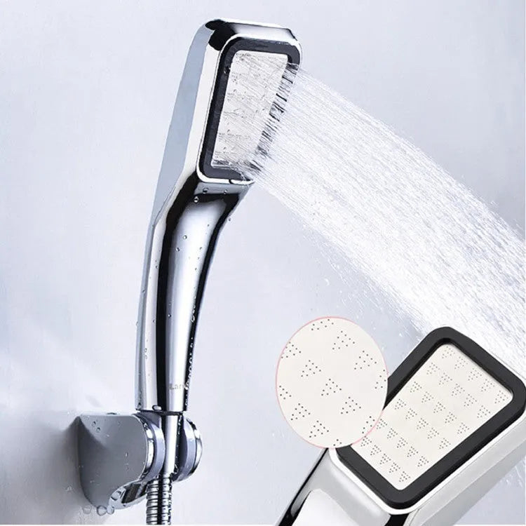 Orange hand-held rain shower set with pressurised function showing shower head and connection