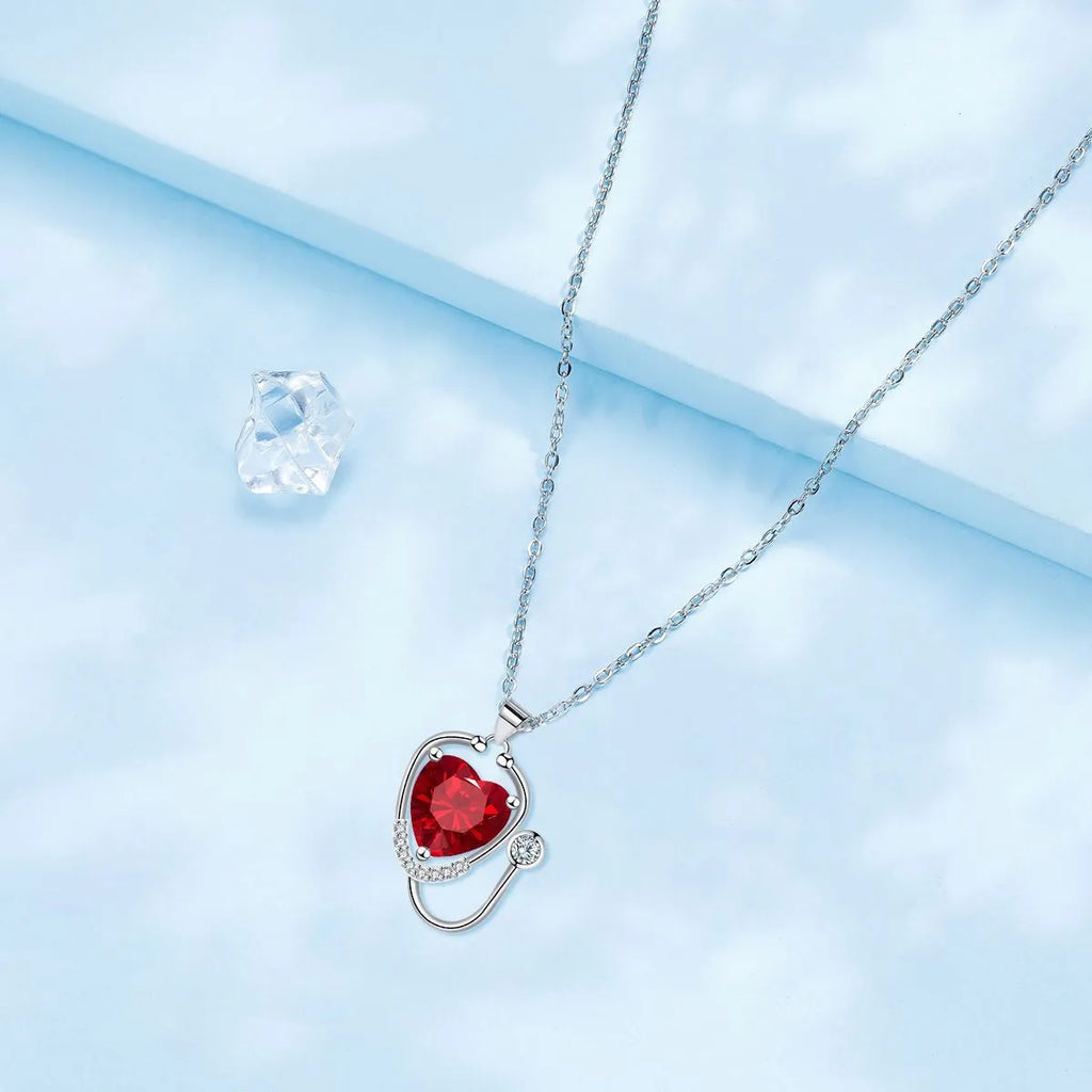 Women's fashion necklace with wings cross stethoscope pendant in red diamond colour