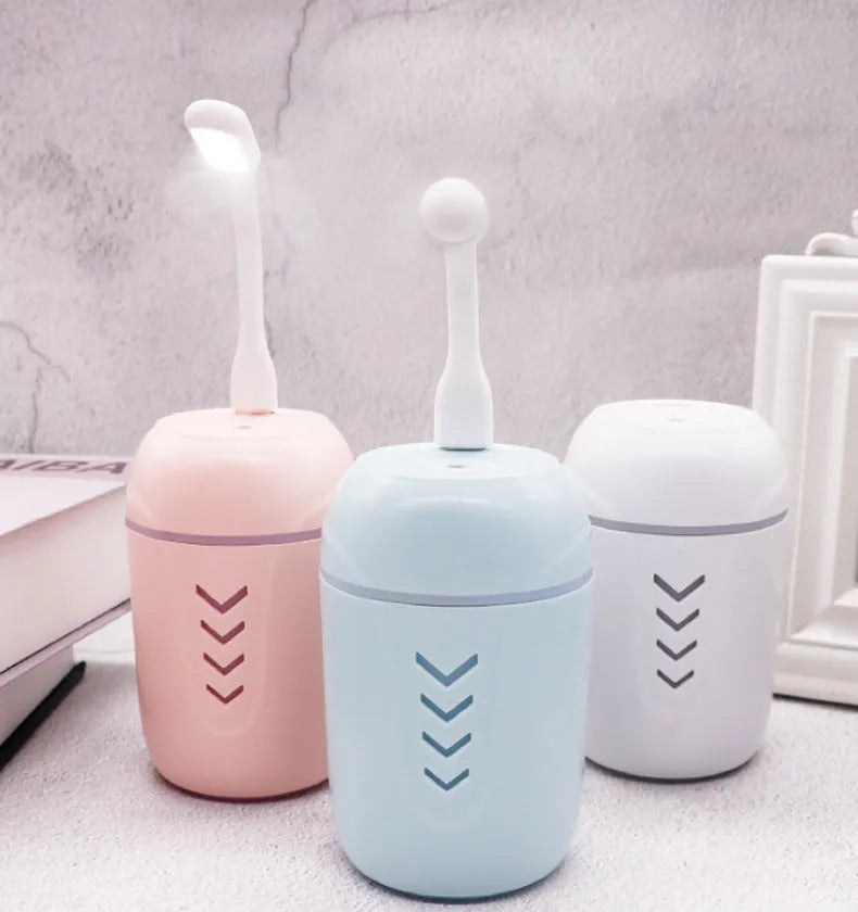 X3 portable car humidifier with columnar shape in blue, showing USB cable and 200ml water tank capacity.