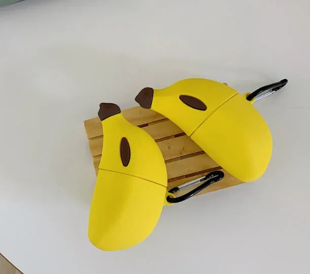 Yellow banana-shaped silicone protective case for Apple AirPods Pro and AirPods 3rd generation.
