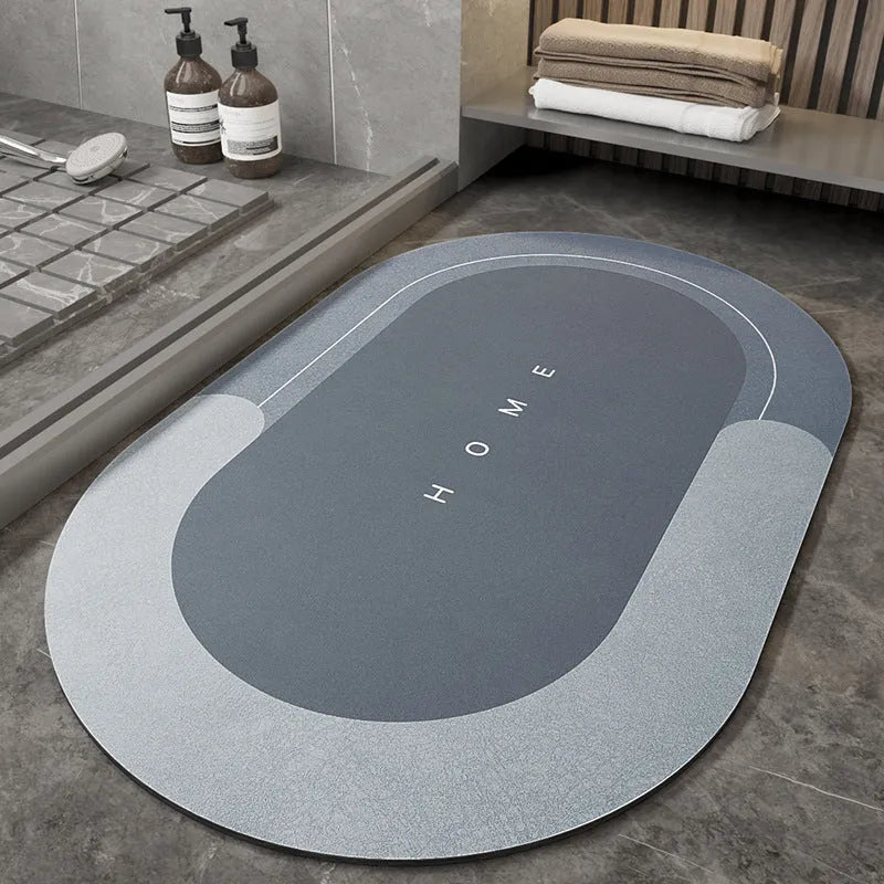 Blended fabric bathroom floor mat in blue colour, shown in an oval shape on a tiled floor.