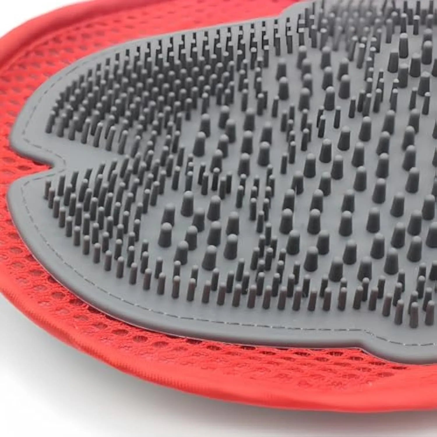 Red pet bathing glove with integrated brush bristles for grooming and massage