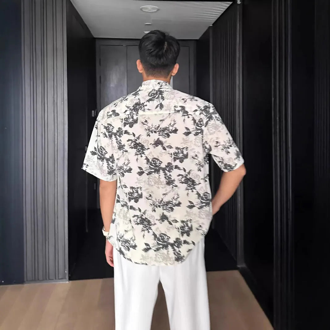 Men's loose black floral printed casual shirt with short sleeves and cardigan style